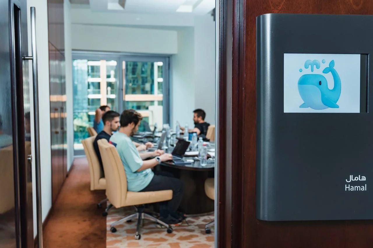 Office workspace with whale logo