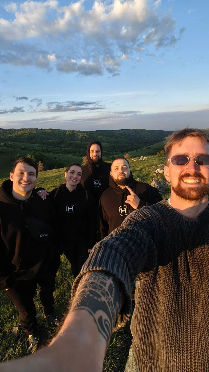 Team selfie in scenic hills